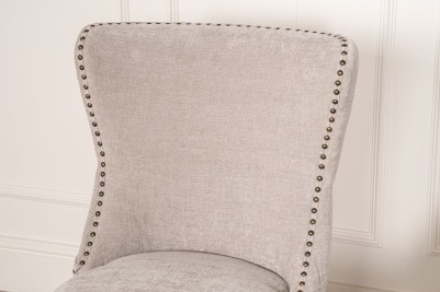 grey chair with brass studs